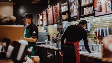 starbucks employees serving coffee