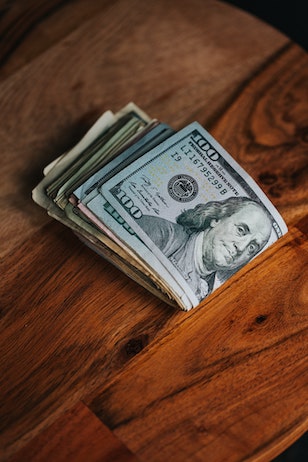 USD folded on table