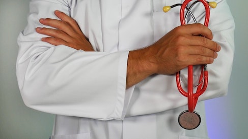 doctor with stethoscope in hands 