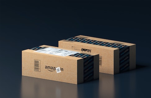 two amazon parcels on black table