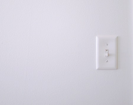 switch on white wall
