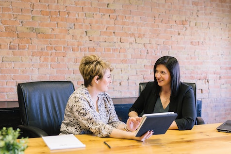 people discussing payroll in office