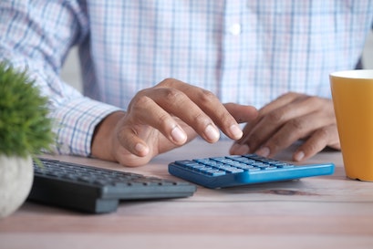 person calculating jbs tax