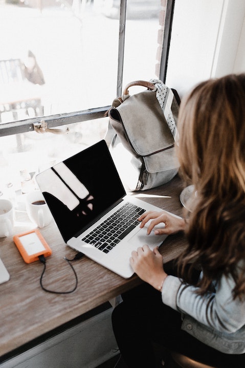 person at laptop filling out w2