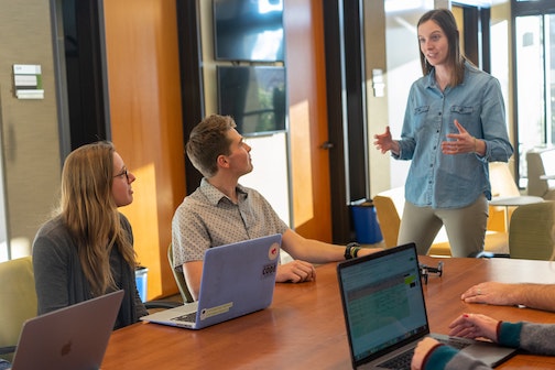 employees around meeting table