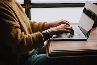person using adp payroll online