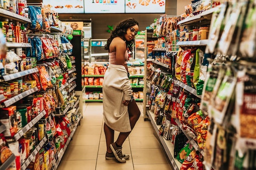 women in a store aisle 