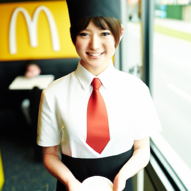 asian mcdonalds employee receiving pay check 