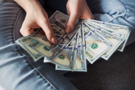 100 USD bills fanned out