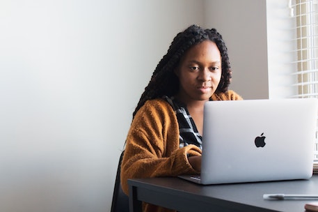 employee on mac laptop